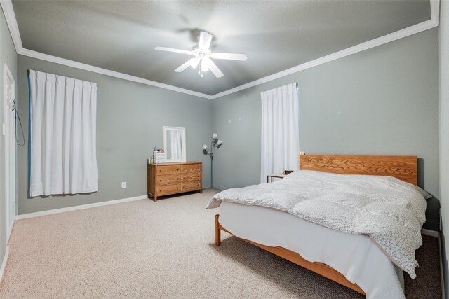 2255 Braeswood Park Dr Unit 294, Houston, TX 77030 - carpeted bedroom with ornamental molding, a ceiling fan, and baseboards