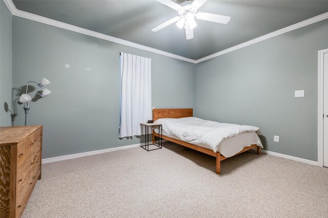 2255 Braeswood Park Dr Unit 294, Houston, TX 77030 - carpeted bedroom featuring crown molding, baseboards, and ceiling fan