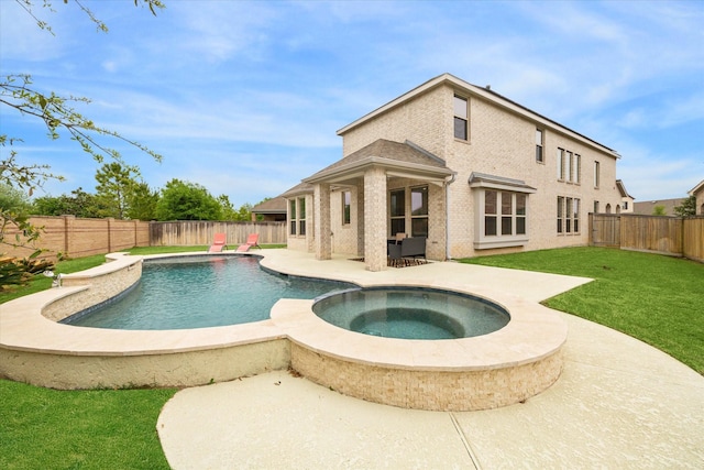 15039 Eves Necklace Ct, Cypress, TX 77433 - view of swimming pool featuring a patio, a pool with connected hot tub, a lawn, and a fenced backyard