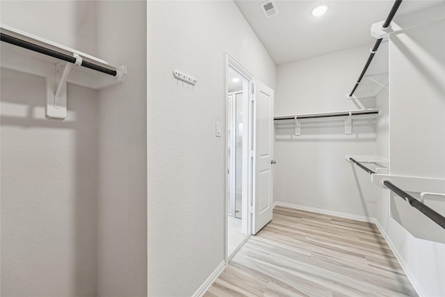 15039 Eves Necklace Ct, Cypress, TX 77433 - spacious closet with light wood-type flooring and visible vents