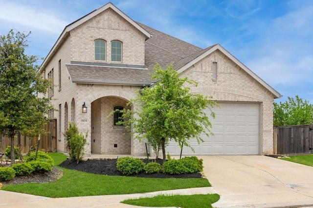 15039 Eves Necklace Ct, Cypress, TX 77433 - view of front facade featuring a garage, fence, concrete driveway, brick siding, and roof with shingles