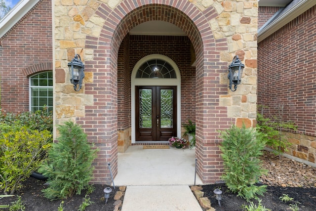 4911 Ontonagon Way, Spring, TX 77386 - view of exterior entry with french doors and brick siding