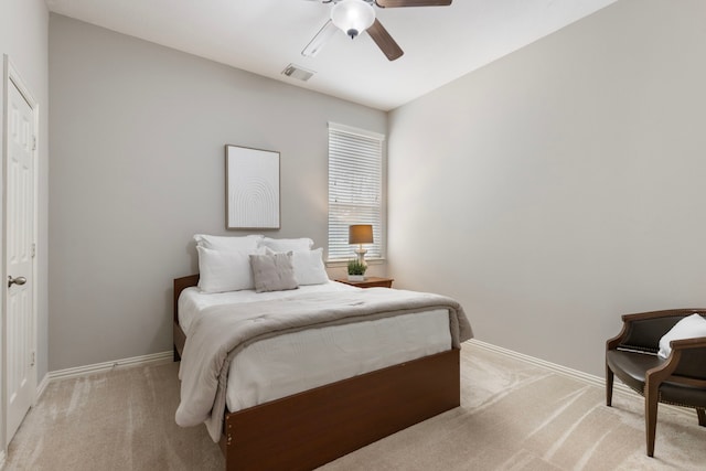 bedroom with light carpet, baseboards, and visible vents