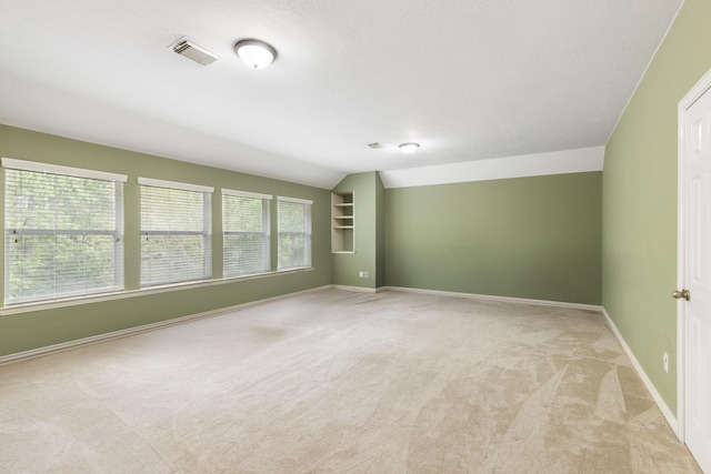 4911 Ontonagon Way, Spring, TX 77386 - unfurnished room with light colored carpet, lofted ceiling, and baseboards