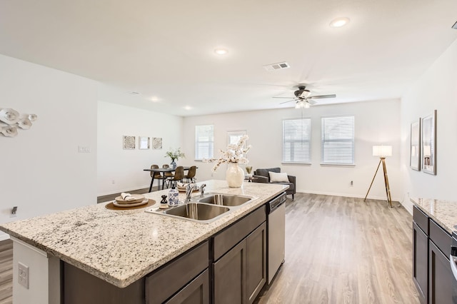 25617 Microstar Way, Montgomery, TX 77316 - kitchen with a sink, light wood-style floors, ceiling fan, stainless steel dishwasher, and recessed lighting