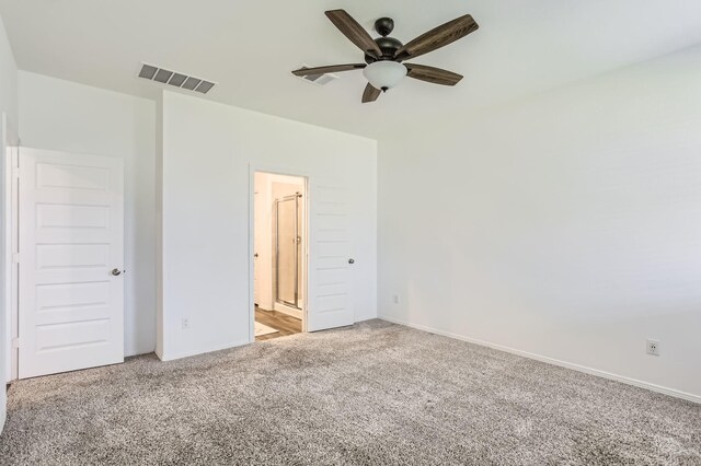 25617 Microstar Way, Montgomery, TX 77316 - unfurnished bedroom featuring light carpet, connected bathroom, and baseboards