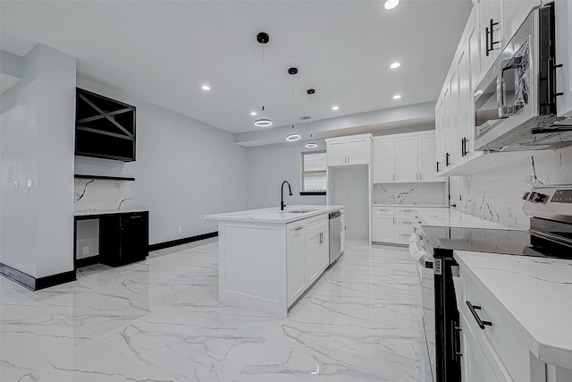 kitchen featuring recessed lighting, backsplash, marble finish floor, a sink, and appliances with stainless steel finishes