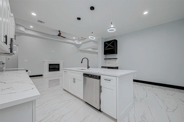 kitchen with dishwasher, marble finish floor, a sink, and visible vents