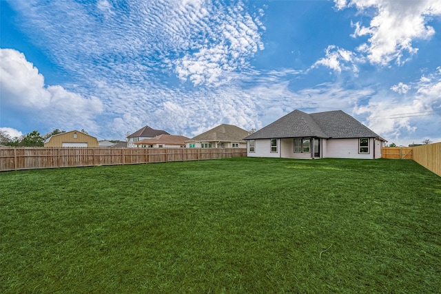 view of yard with a fenced backyard