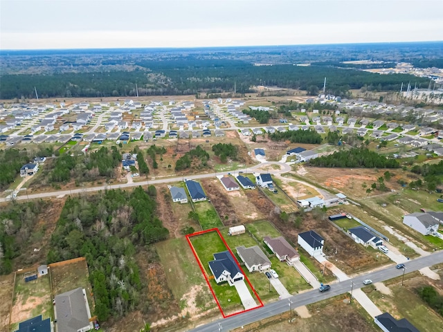 birds eye view of property with a residential view