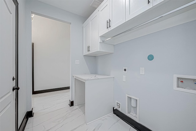 washroom featuring hookup for a washing machine, baseboards, marble finish floor, electric dryer hookup, and cabinet space