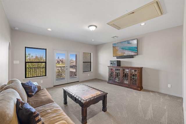 12606 Mostyn Ct, Magnolia, TX 77354 - living area with baseboards, recessed lighting, carpet flooring, and attic access