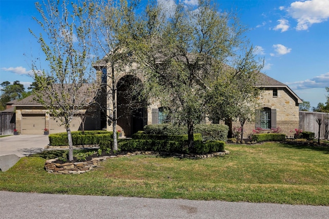 12606 Mostyn Ct, Magnolia, TX 77354 - obstructed view of property with stone siding, driveway, brick siding, and a front yard