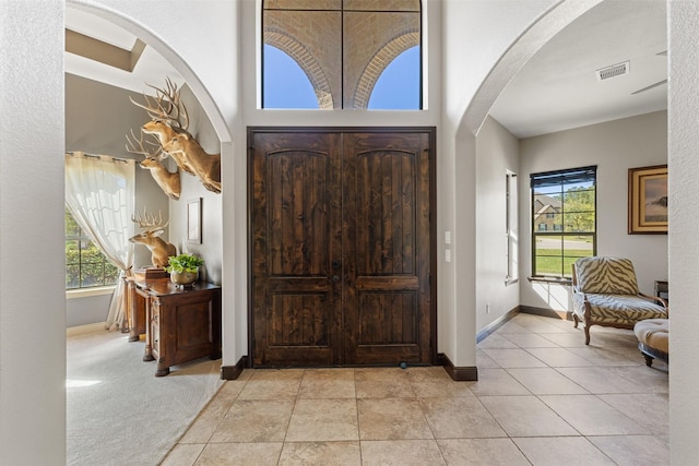 12606 Mostyn Ct, Magnolia, TX 77354 - entryway with arched walkways, baseboards, and visible vents