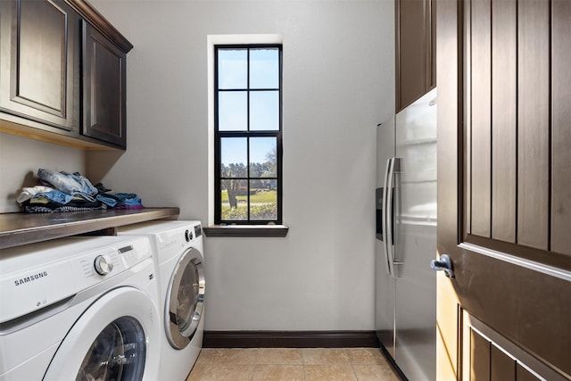 12606 Mostyn Ct, Magnolia, TX 77354 - clothes washing area featuring washer and clothes dryer, cabinet space, and baseboards