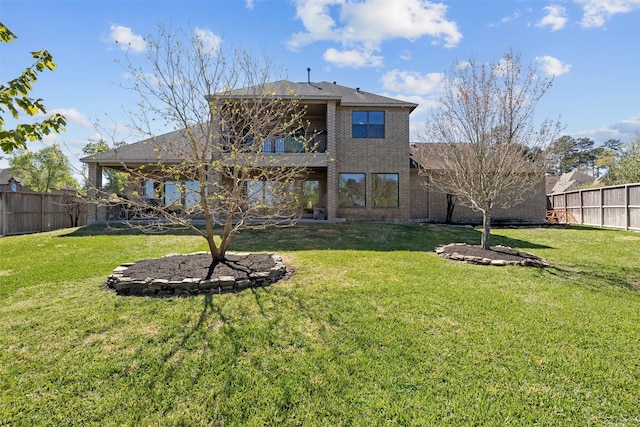 12606 Mostyn Ct, Magnolia, TX 77354 - rear view of property featuring a fenced backyard, brick siding, and a yard