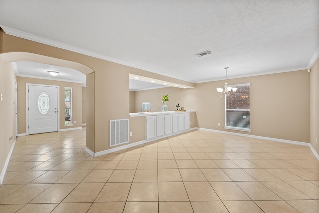 1231 Kings Creek Trl, Missouri City, TX 77459 - entrance foyer with crown molding, visible vents, an inviting chandelier, and light tile patterned floors