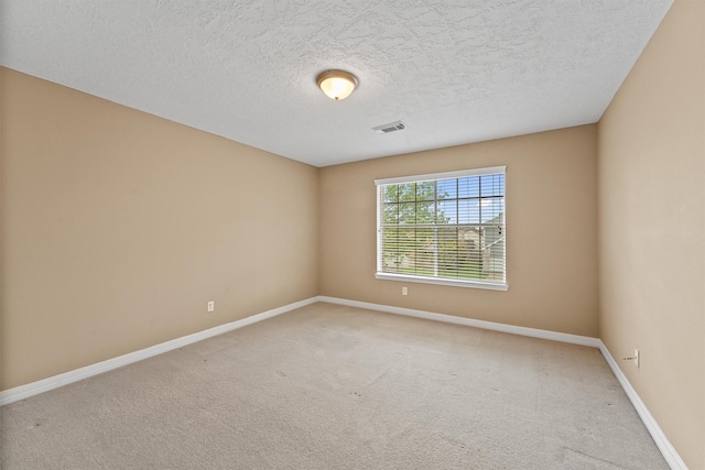 1231 Kings Creek Trl, Missouri City, TX 77459 - carpeted empty room with a textured ceiling, baseboards, and visible vents