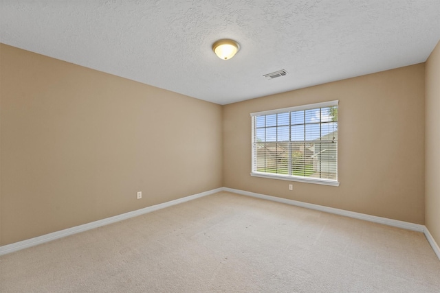 1231 Kings Creek Trl, Missouri City, TX 77459 - unfurnished room featuring light carpet, visible vents, baseboards, and a textured ceiling