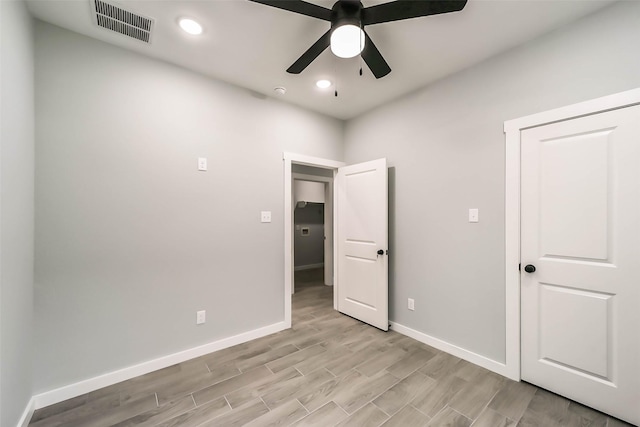 unfurnished bedroom featuring baseboards, visible vents, light wood-style flooring, and recessed lighting