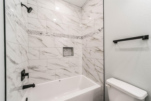 bathroom with toilet and washtub / shower combination