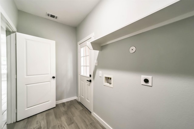 laundry room featuring hookup for a washing machine, dark wood finished floors, visible vents, electric dryer hookup, and laundry area