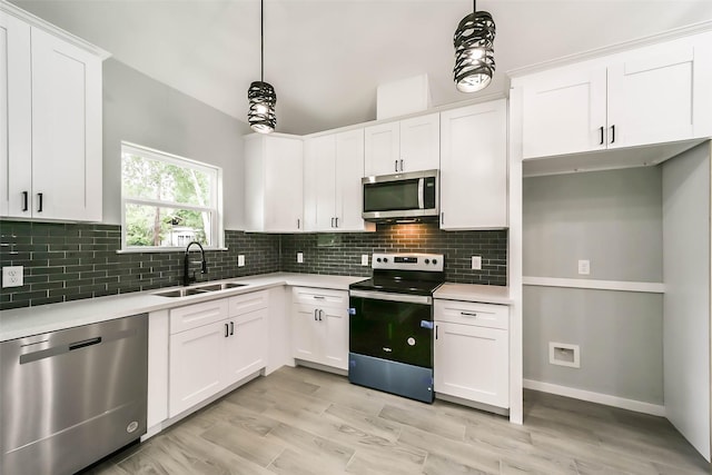 kitchen featuring light countertops, a sink, and stainless steel appliances