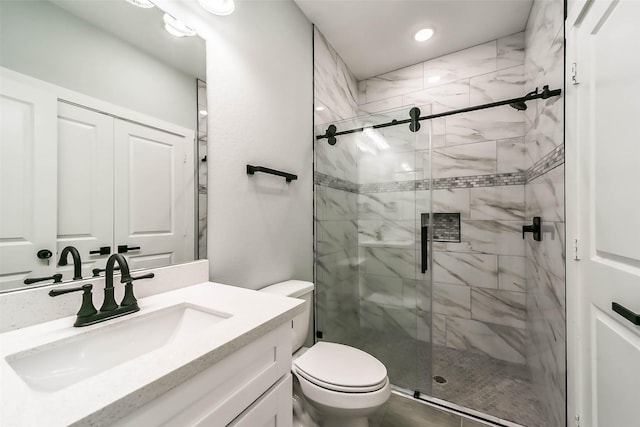 bathroom featuring vanity, toilet, recessed lighting, and a shower stall