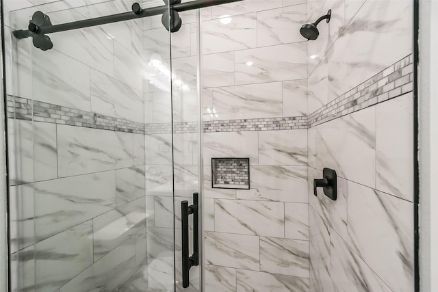 full bathroom with a shower stall
