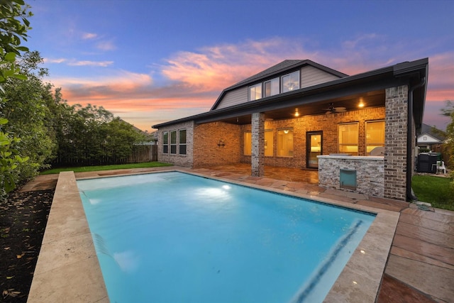 31021 Harvest Meadow Ln, Spring, TX 77386 - back of property featuring brick siding, a ceiling fan, central air condition unit, and a patio