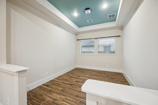 31021 Harvest Meadow Ln, Spring, TX 77386 - spare room with dark wood finished floors, a tray ceiling, and recessed lighting
