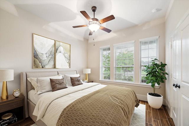 31021 Harvest Meadow Ln, Spring, TX 77386 - bedroom with dark wood-style floors and a ceiling fan