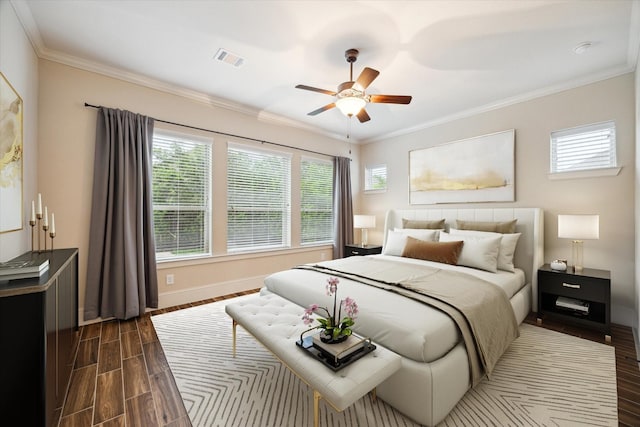 31021 Harvest Meadow Ln, Spring, TX 77386 - bedroom featuring dark wood-style floors, ornamental molding, and ceiling fan