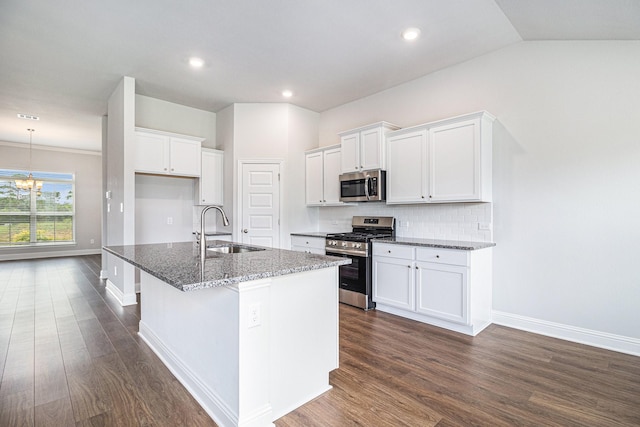 4214 Leslies Way, Dickinson, TX 77539 - kitchen featuring stainless steel appliances, a sink, dark wood finished floors, white cabinetry, and recessed lighting