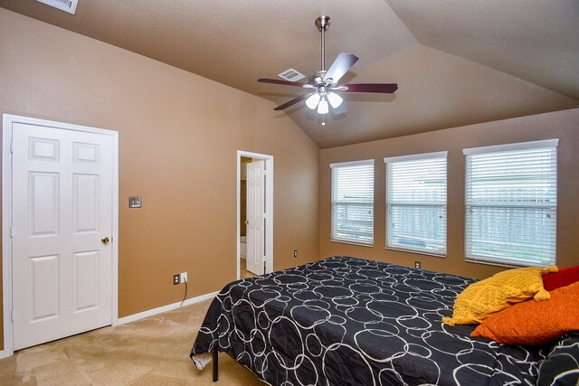 bedroom with ceiling fan, visible vents, vaulted ceiling, baseboards, and carpet flooring