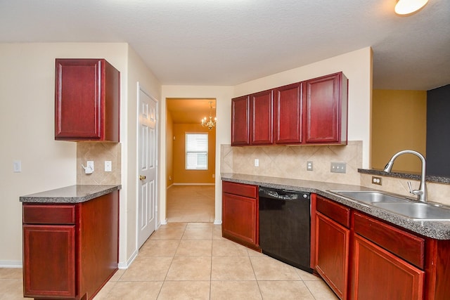 kitchen with dark countertops, dark brown cabinets, a sink, a notable chandelier, and black dishwasher