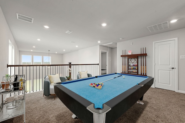 rec room featuring attic access, visible vents, and carpet