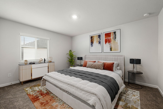 carpeted bedroom with baseboards