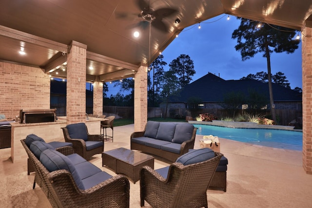 1002 Timberland Bay Ct, Pinehurst, TX 77362 - view of patio with area for grilling, a fenced backyard, an outdoor hangout area, a fenced in pool, and an outdoor kitchen