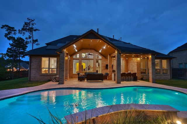 1002 Timberland Bay Ct, Pinehurst, TX 77362 - view of swimming pool featuring a yard, an outdoor living space, fence, a patio, and a fenced in pool