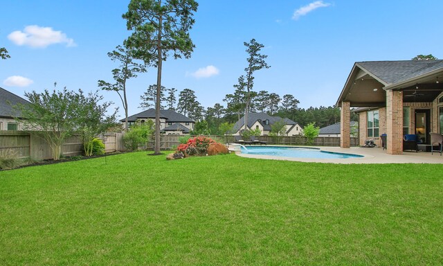 1002 Timberland Bay Ct, Pinehurst, TX 77362 - view of yard with a fenced backyard, ceiling fan, a fenced in pool, and a patio
