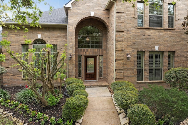 11812 Sea Shadow Bnd, Pearland, TX 77584 - entrance to property with roof with shingles and brick siding