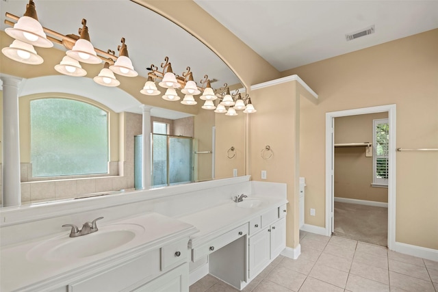 11812 Sea Shadow Bnd, Pearland, TX 77584 - full bath with decorative columns, double vanity, and plenty of natural light