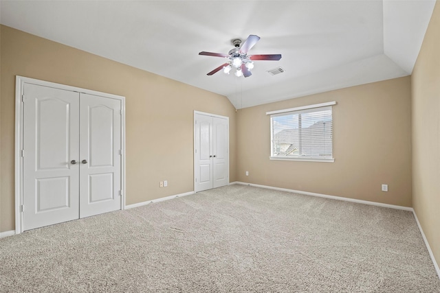 11812 Sea Shadow Bnd, Pearland, TX 77584 - unfurnished bedroom with multiple closets, carpet flooring, and a ceiling fan