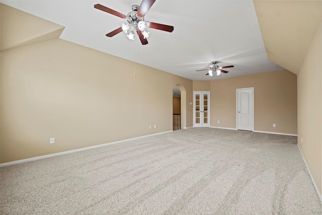 11812 Sea Shadow Bnd, Pearland, TX 77584 - empty room featuring ceiling fan, arched walkways, carpet, lofted ceiling, and french doors