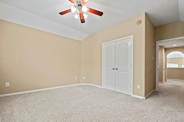 11812 Sea Shadow Bnd, Pearland, TX 77584 - unfurnished bedroom featuring carpet, a closet, lofted ceiling, arched walkways, and ceiling fan
