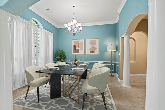 11812 Sea Shadow Bnd, Pearland, TX 77584 - tiled dining room with ornamental molding, a chandelier, and decorative columns