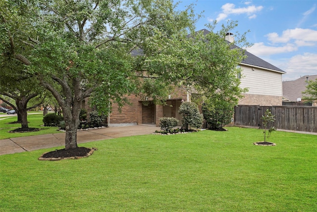 11812 Sea Shadow Bnd, Pearland, TX 77584 - obstructed view of property featuring brick siding and a chimney