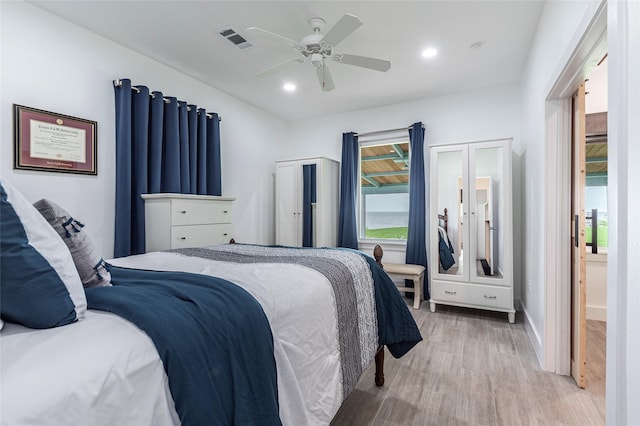 bedroom featuring recessed lighting, ceiling fan, visible vents, light wood-style flooring, and baseboards