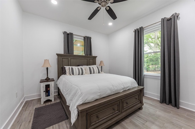 bedroom with recessed lighting, ceiling fan, baseboards, and light wood-type flooring